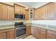 Kitchen with stainless steel appliances and ample cabinet space at 30034 N 128Th Ave, Peoria, AZ 85383