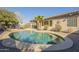 Inviting kidney-shaped pool with ample surrounding deck space at 30034 N 128Th Ave, Peoria, AZ 85383