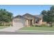 Single-story home with attached garage and landscaping at 3025 E Grazing Herd Ln, San Tan Valley, AZ 85140