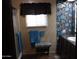 Bathroom with teal floral wallpaper and shower at 303 S Recker Rd # 9, Mesa, AZ 85206