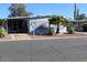 Front view of manufactured home with covered patio and landscaping at 303 S Recker Rd # 9, Mesa, AZ 85206