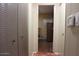 Long hallway with built-in storage and access to other rooms at 303 S Recker Rd # 9, Mesa, AZ 85206