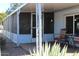 Screened porch with seating area next to mobile home at 303 S Recker Rd # 9, Mesa, AZ 85206