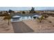 New construction home with a large driveway and desert landscaping at 34902 W Caldwell St, Tonopah, AZ 85354