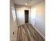 Bright bedroom with wood-look flooring and closet at 34902 W Caldwell St, Tonopah, AZ 85354