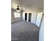 Large bedroom with carpet, ceiling fan, and closets at 34902 W Caldwell St, Tonopah, AZ 85354