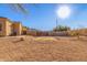 Large gravel backyard with a view of the mountains at 3630 W Bohl St, Laveen, AZ 85339