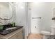 Modern bathroom with patterned walls, black vanity, and shower at 3630 W Bohl St, Laveen, AZ 85339