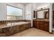 Bathroom boasts a large soaking tub and double vanity with granite top at 3630 W Bohl St, Laveen, AZ 85339