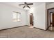 Bright bedroom with carpeted floors and large window at 3630 W Bohl St, Laveen, AZ 85339