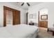 Bedroom with ensuite bathroom and ceiling fan at 3630 W Bohl St, Laveen, AZ 85339