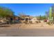 Desert landscaping surrounds this single-story home with a large driveway and 3-car garage at 3630 W Bohl St, Laveen, AZ 85339