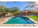 Relaxing kidney-shaped pool and spacious backyard at 3630 W Bohl St, Laveen, AZ 85339