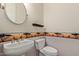 Small bathroom with pedestal sink and decorative border at 3817 E Cielo Grande Ave, Phoenix, AZ 85050