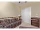 Charming bedroom with plaid couch and built-in shelving at 3817 E Cielo Grande Ave, Phoenix, AZ 85050