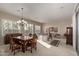 Elegant dining room featuring a formal wood table and chandelier at 3817 E Cielo Grande Ave, Phoenix, AZ 85050