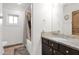 Clean bathroom with single sink, granite countertop and bathtub at 3848 W Morrow Dr, Glendale, AZ 85308