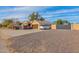 House with a gravel driveway and gated entrance at 3848 W Morrow Dr, Glendale, AZ 85308