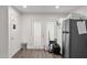 Laundry area with French doors and gray refrigerator at 3848 W Morrow Dr, Glendale, AZ 85308