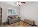 Cozy living area with gray couch and patterned rug at 3848 W Morrow Dr, Glendale, AZ 85308