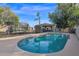 Sparkling kidney-shaped pool with expansive backyard views at 3848 W Morrow Dr, Glendale, AZ 85308