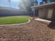 Backyard with artificial turf and covered patio at 3941 E Emile Zola Ave, Phoenix, AZ 85032