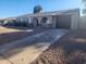 Ranch style home with a two-car garage and rock accents at 3941 E Emile Zola Ave, Phoenix, AZ 85032