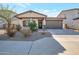 Charming house with attached garage and desert landscaping at 40465 W Chambers Dr, Maricopa, AZ 85138