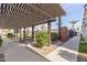 Inviting outdoor common area featuring a pergola, seating, and landscaping at 4058 E Erie E St # 103, Gilbert, AZ 85295