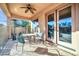 Covered patio with table, chairs, and ceiling fan at 4113 E Burnside Trl, Cave Creek, AZ 85331