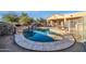 Inviting kidney shaped pool with water feature and surrounding patio at 4113 E Burnside Trl, Cave Creek, AZ 85331