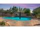 Inviting swimming pool with surrounding stone patio at 4113 E Burnside Trl, Cave Creek, AZ 85331