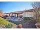 Spacious backyard patio with seating area and built-in grill at 42028 N Crooked Stick Rd, Anthem, AZ 85086