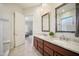 Bathroom with double vanity, granite countertops and a view of a bedroom at 42028 N Crooked Stick Rd, Anthem, AZ 85086