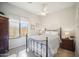 Bedroom with a metal bed frame and ceiling fan at 42028 N Crooked Stick Rd, Anthem, AZ 85086