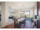 Dining room with table for six and backyard access at 42028 N Crooked Stick Rd, Anthem, AZ 85086