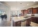 Modern kitchen with granite countertops and stainless steel appliances at 42028 N Crooked Stick Rd, Anthem, AZ 85086