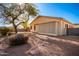 Landscaped backyard with gravel and a tree at 4249 S Pony Rider Trl, Gold Canyon, AZ 85118