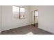 Well-lit bedroom featuring a mirrored closet and window at 4249 S Pony Rider Trl, Gold Canyon, AZ 85118