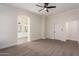 Spacious bedroom with carpet, ceiling fan and en-suite bathroom at 4249 S Pony Rider Trl, Gold Canyon, AZ 85118