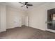 Bright bedroom with carpet, ceiling fan and two doors at 4249 S Pony Rider Trl, Gold Canyon, AZ 85118