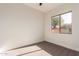 Bright bedroom with carpet flooring and a large window at 4249 S Pony Rider Trl, Gold Canyon, AZ 85118