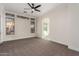 Spacious bedroom with carpet, ceiling fan, and en-suite bathroom at 4249 S Pony Rider Trl, Gold Canyon, AZ 85118