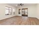 Spacious bedroom with wood-look floors and sliding glass door to patio at 4249 S Pony Rider Trl, Gold Canyon, AZ 85118