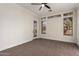 Bedroom with carpet, ceiling fan, and door to exterior at 4249 S Pony Rider Trl, Gold Canyon, AZ 85118