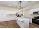 Modern kitchen with white cabinets and an island at 4249 S Pony Rider Trl, Gold Canyon, AZ 85118