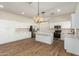 Modern kitchen with white cabinets, stainless steel appliances, and an island at 4249 S Pony Rider Trl, Gold Canyon, AZ 85118