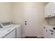 Laundry room with washer, dryer, and cabinets at 4249 S Pony Rider Trl, Gold Canyon, AZ 85118