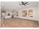 Bright and airy living room features hardwood floors and ceiling fan at 4249 S Pony Rider Trl, Gold Canyon, AZ 85118