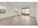 Bright and airy living room with wood-look tile floors at 4961 W Walatowa St, Laveen, AZ 85339